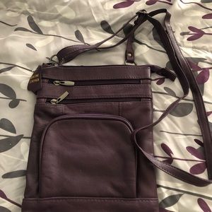 Genuine Leather Cross body bag brand new never used. Purple